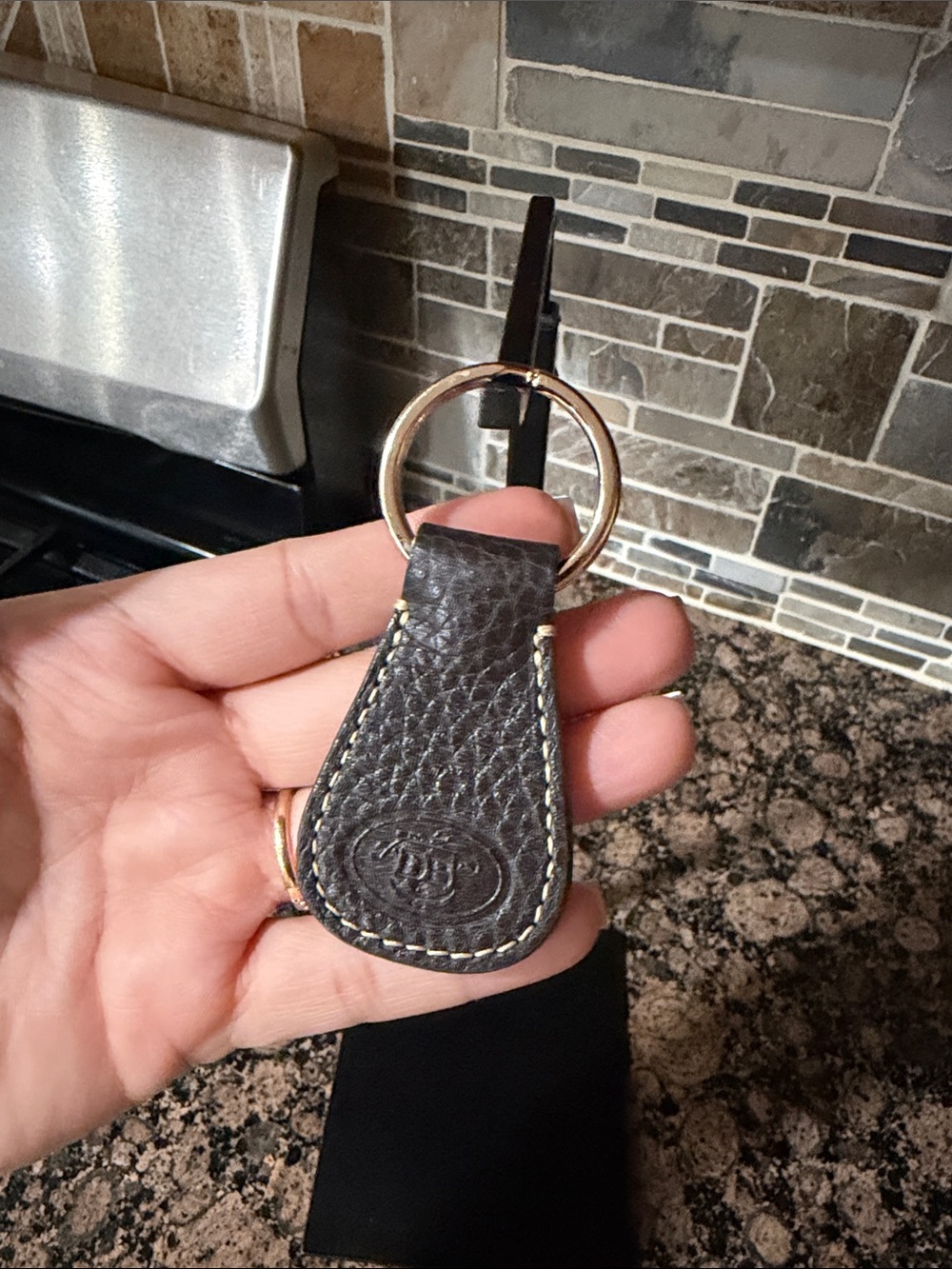 Dooney and Bourke Classic Brown Leather Key Fob with gold Metal Ring